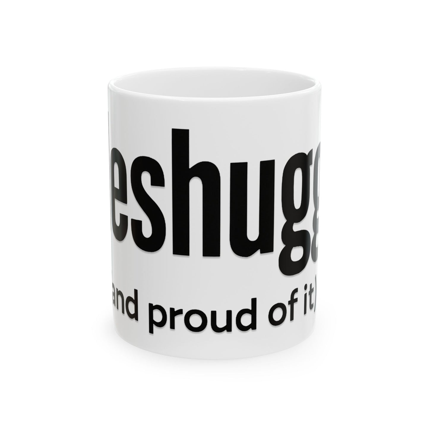 White mug with black 'meshugga' text on a white background