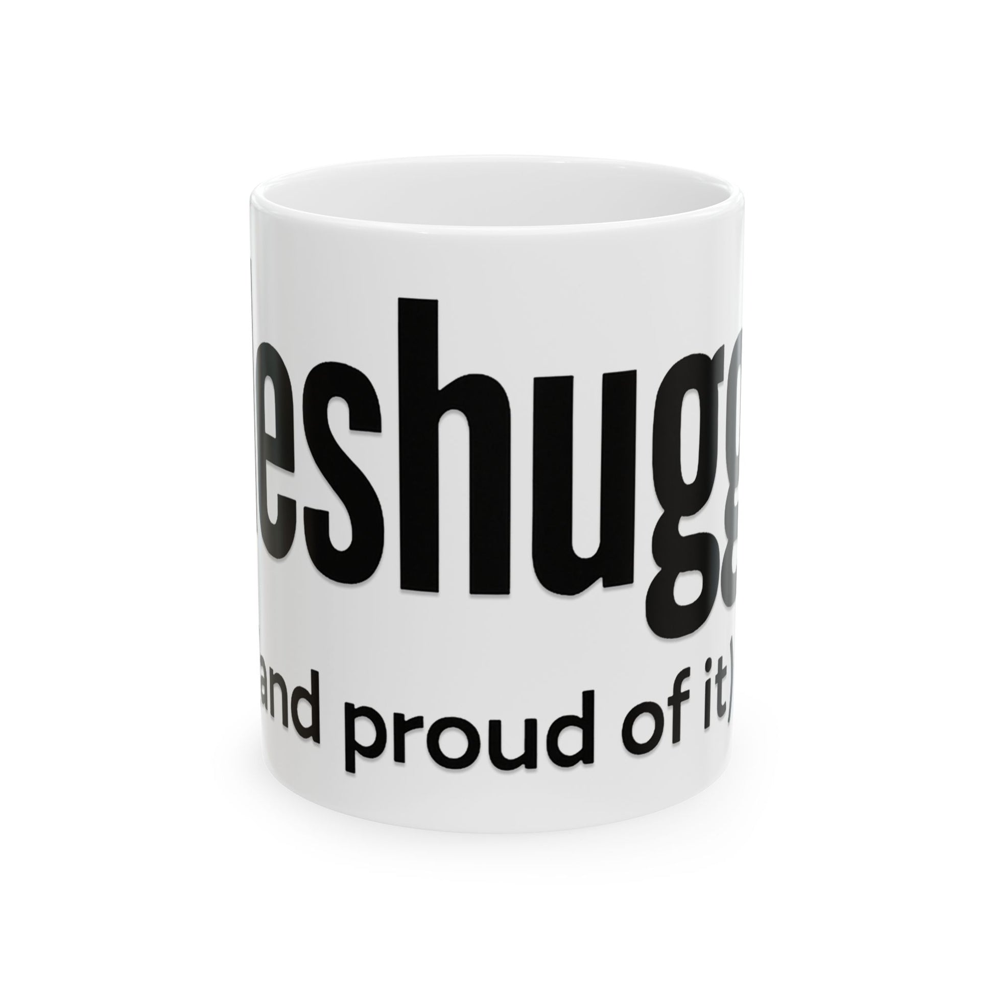White mug with black 'meshugga' text on a white background