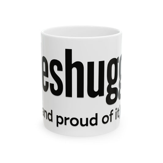 White mug with black 'meshugga' text on a white background