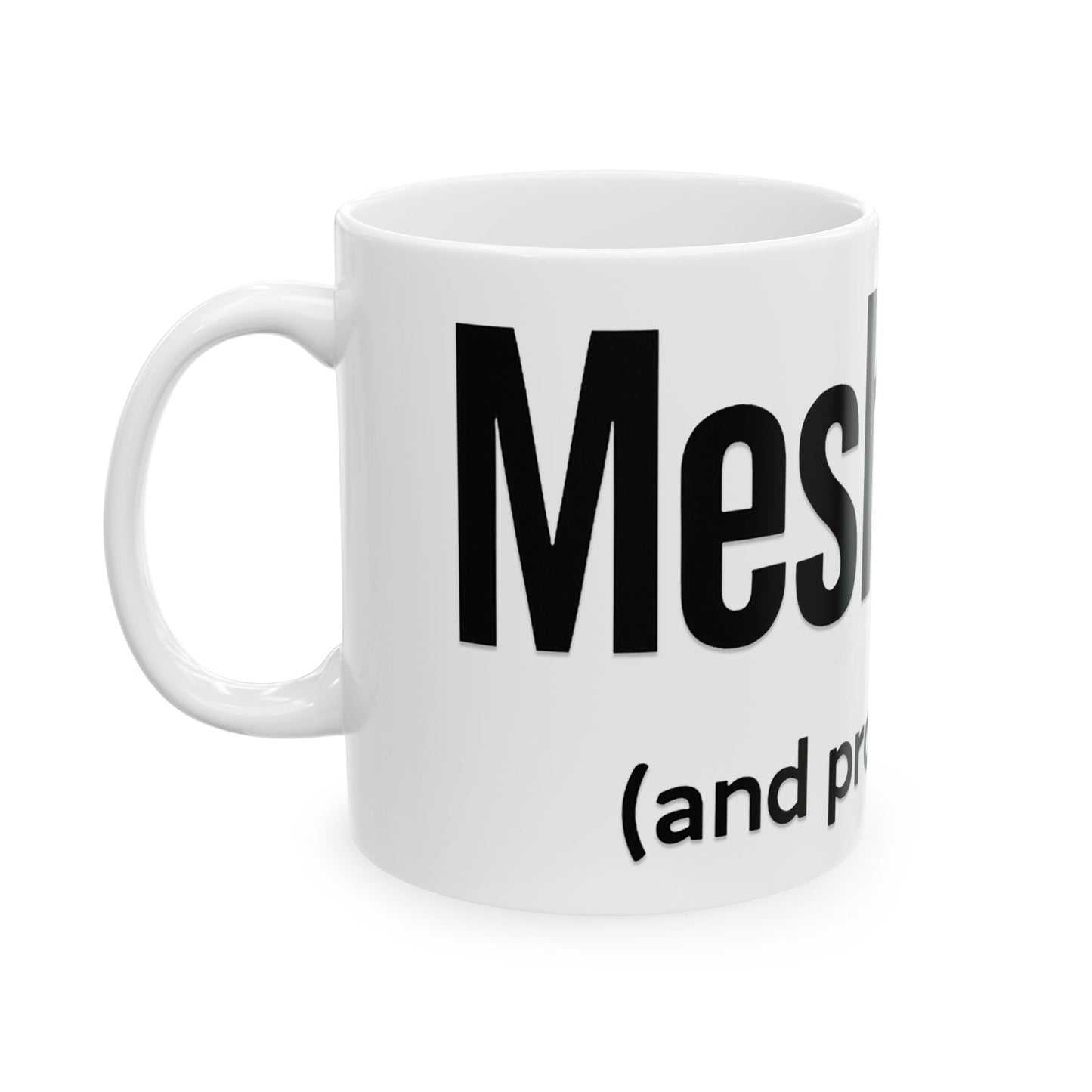 White mug with black text 'meshugga' on a white background