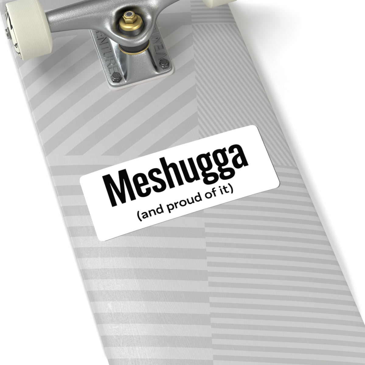 Skateboard with a 'Meshugga (and proud of it)' sticker on a white background