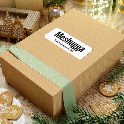 Wooden gift box with a green ribbon and 'Meshugga' label, surrounded by festive decor.