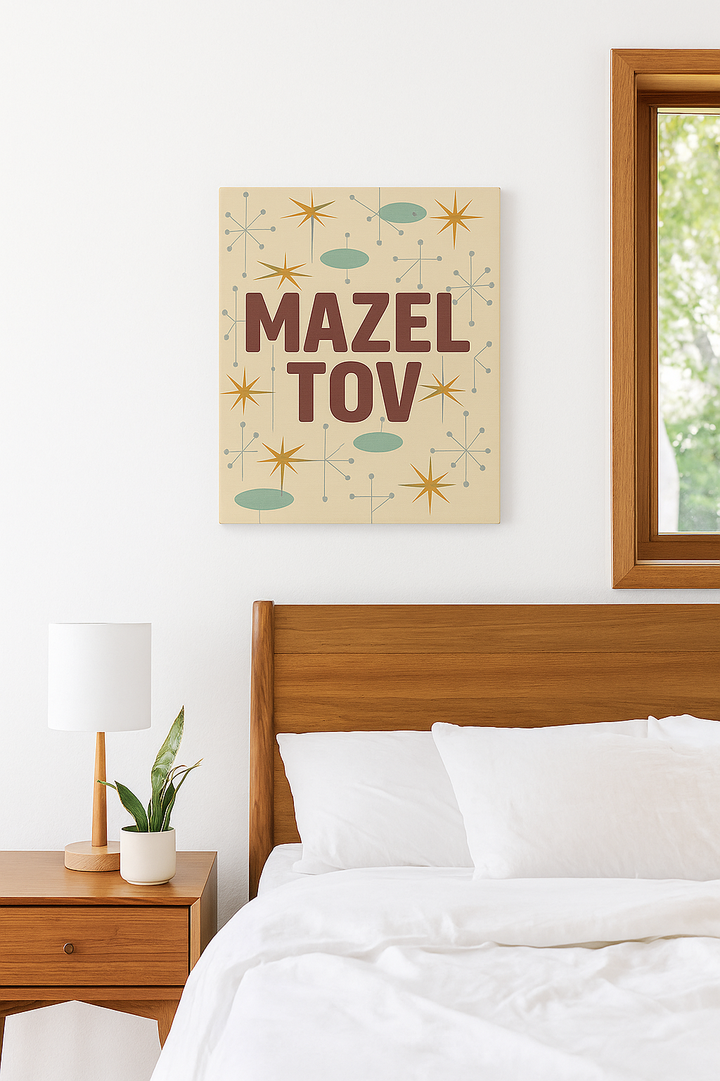Bedroom with a 'Mazel Tov' print on the wall