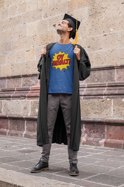 Graduate wearing a blue t-shirt with a yellow graphic design, standing against a stone wall.