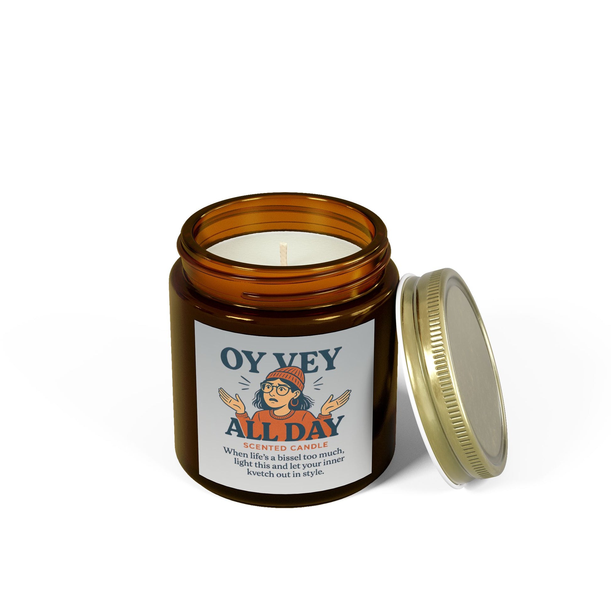 Amber glass candle jar with a label on a white background