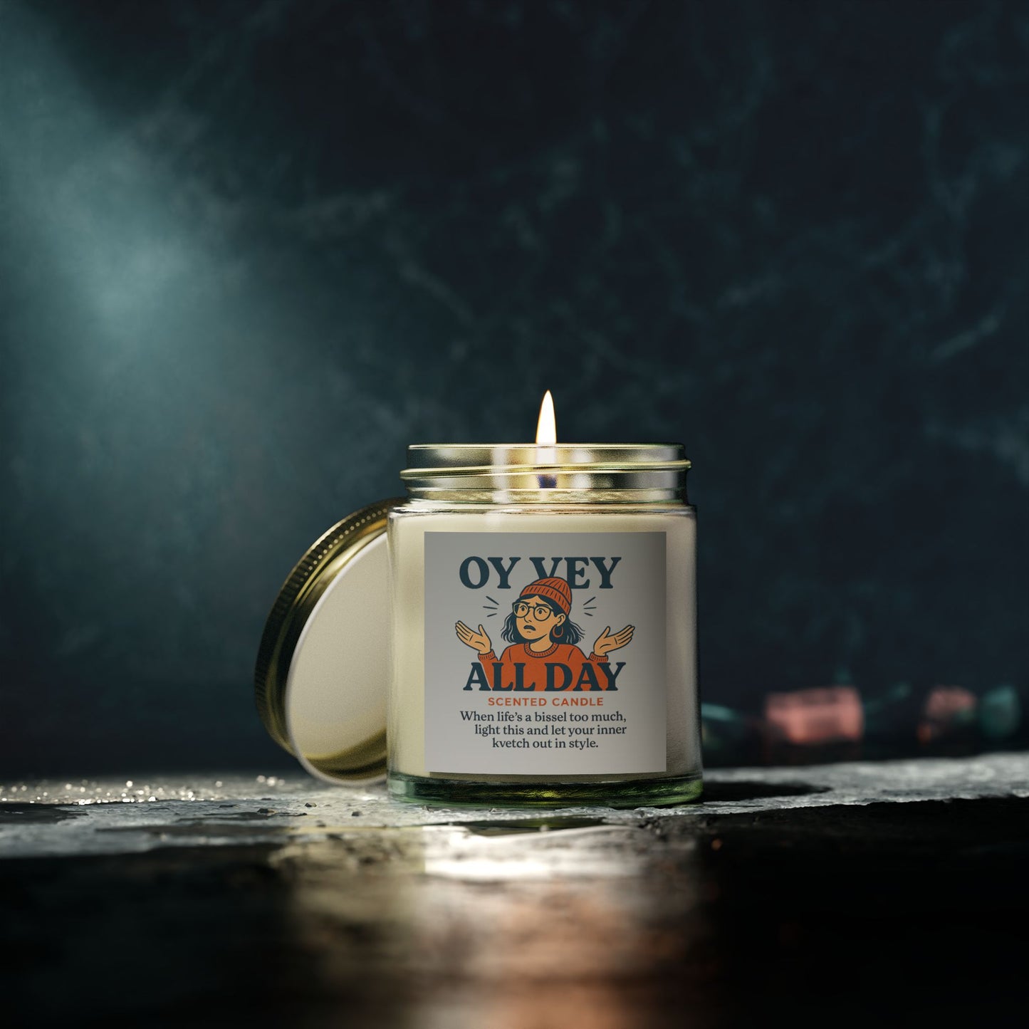 Candle with a label on a dark background