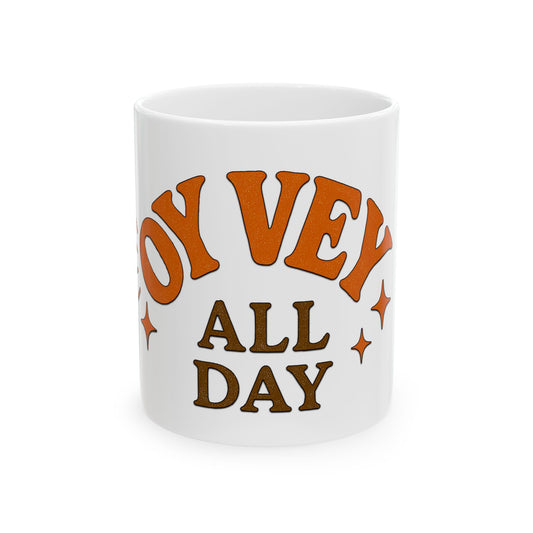 White mug with orange and brown text 'Oy Vey All Day' on a white background