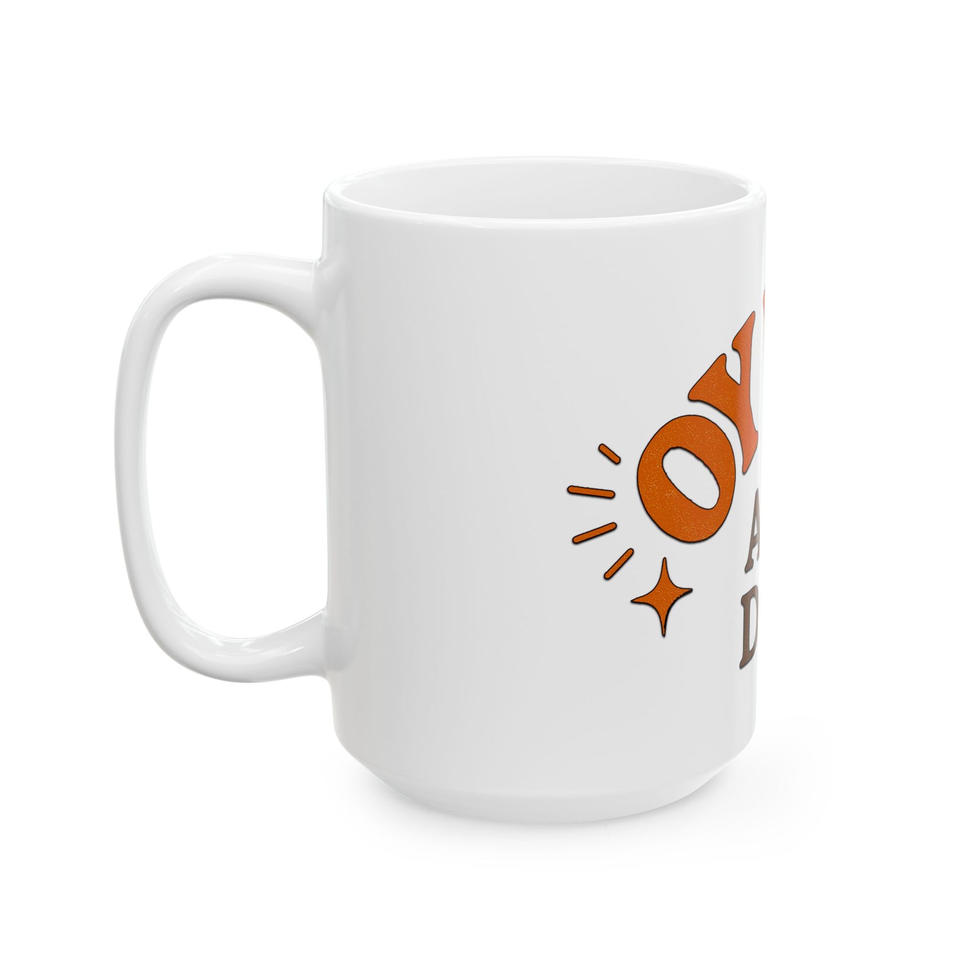 White mug with orange and brown design on a white background