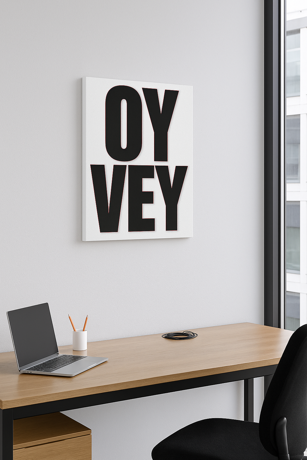Modern office setup with 'OY Vey' artwork on the wall