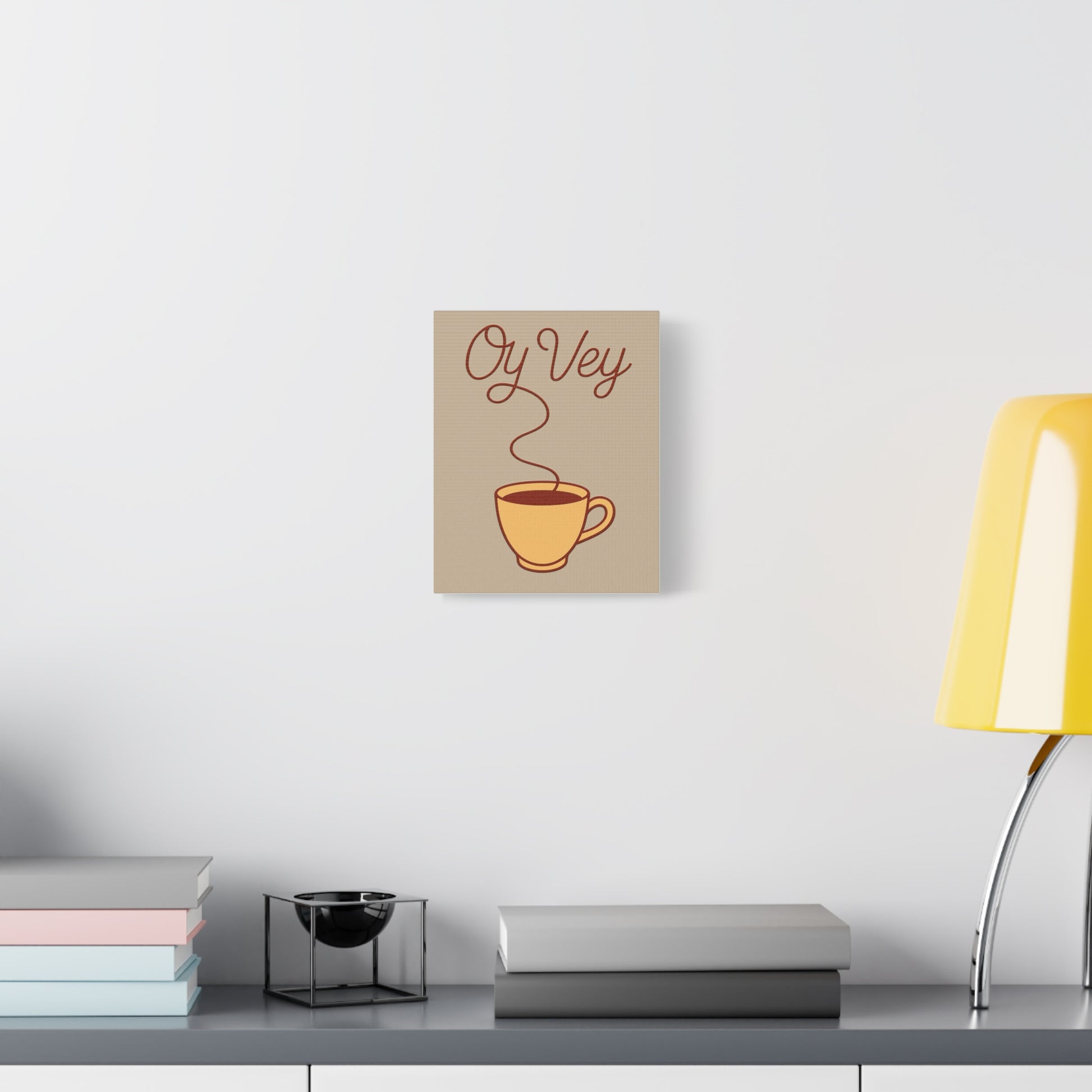 Decorative wall art with a coffee cup and 'Oy Vey' text on a neutral background.