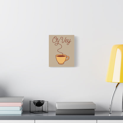 Decorative wall art with a coffee cup and 'Oy Vey' text on a neutral background.