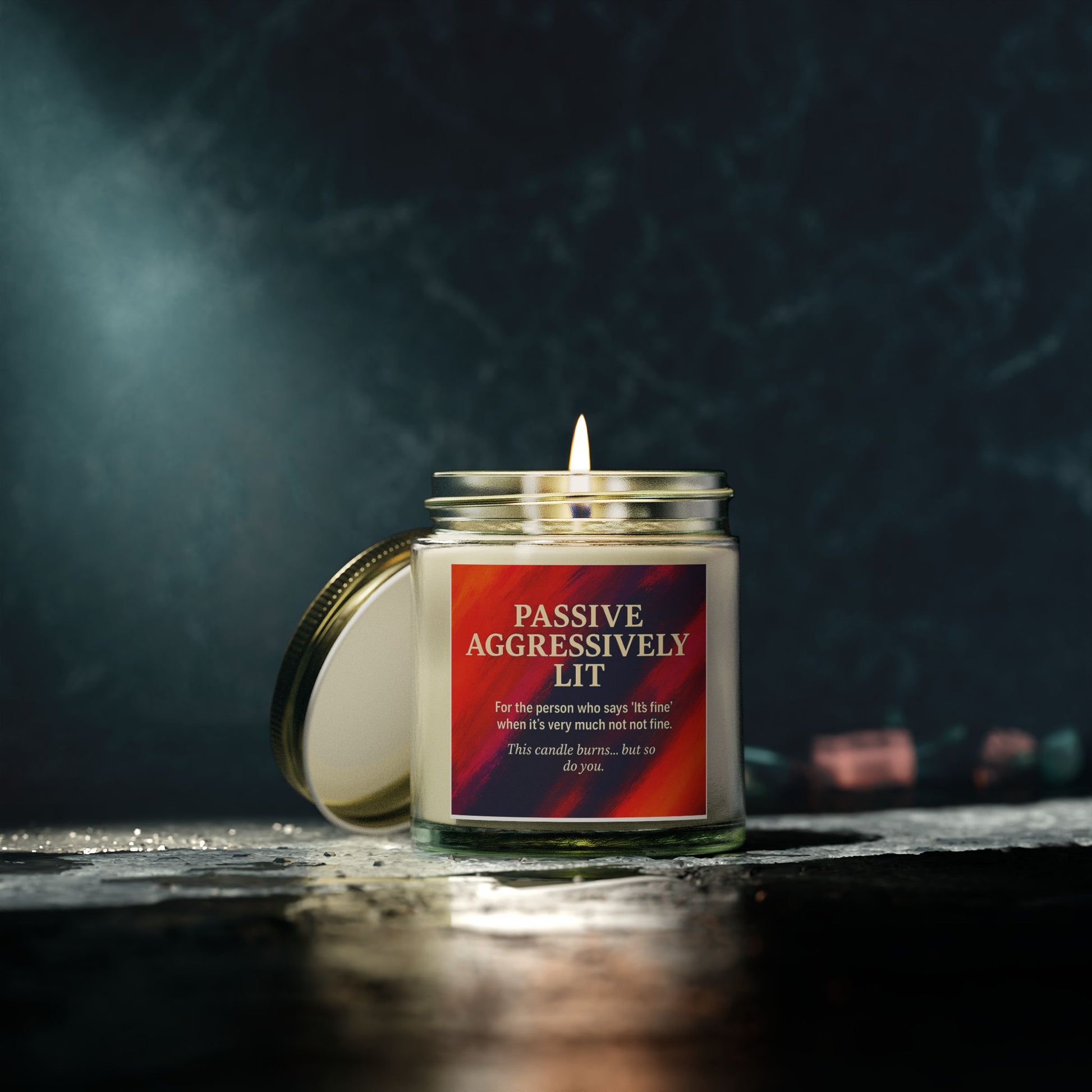 Candle with a humorous label on a dark background