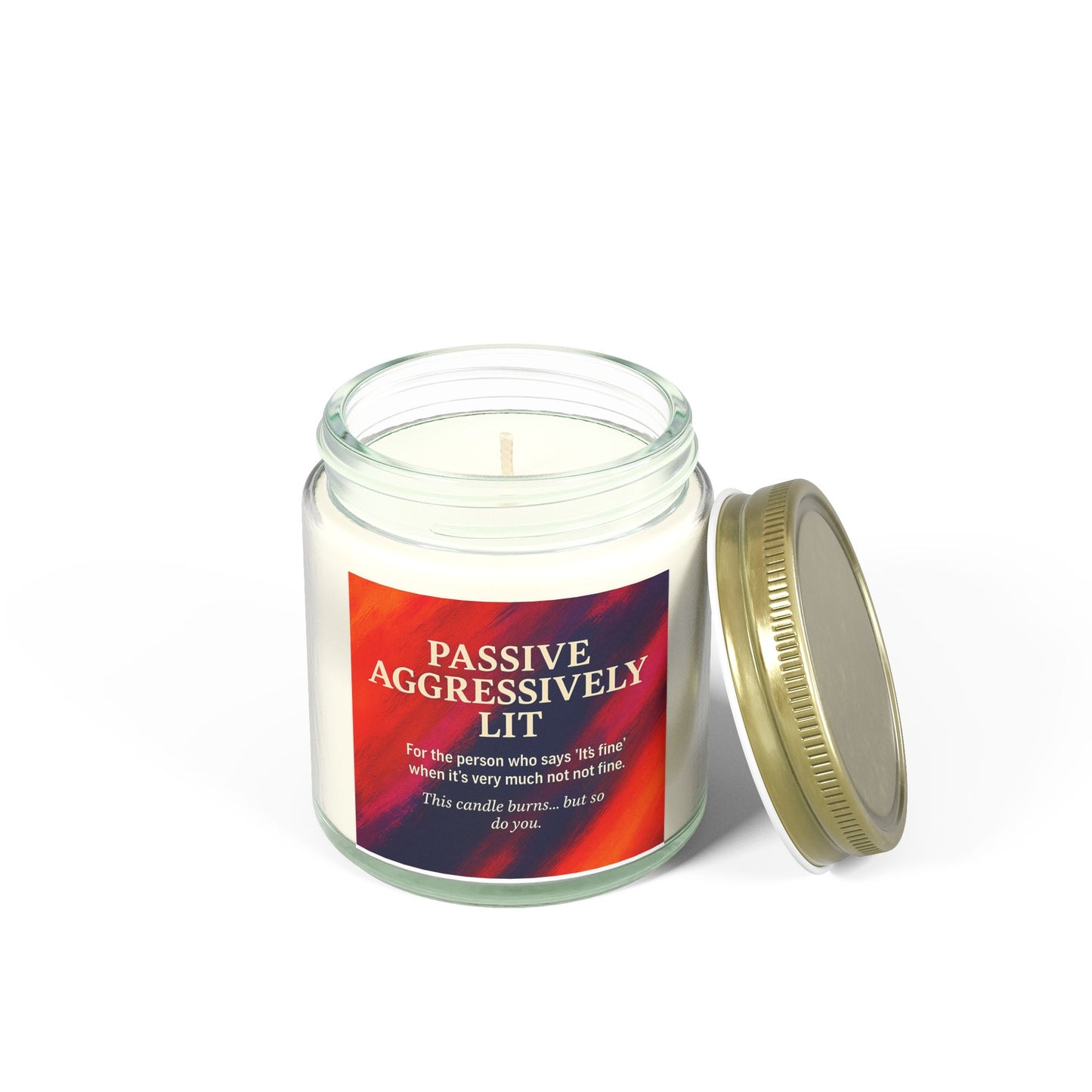 Candle in a glass jar with a red label on a white background