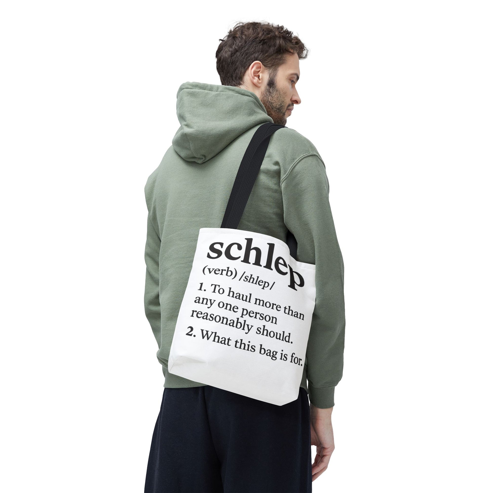 Person wearing a green hoodie with a white bag featuring the word 'schlep' on a white background