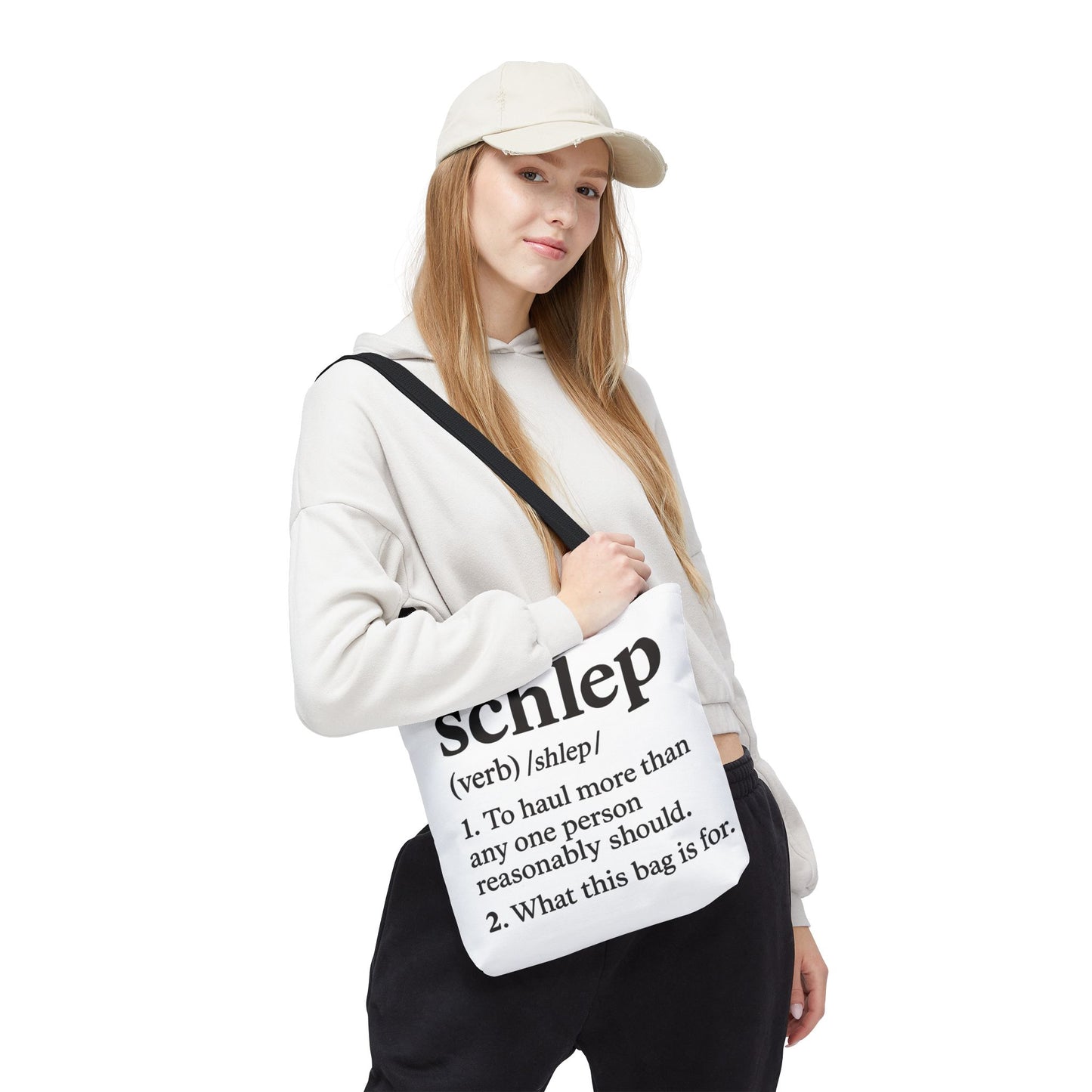 Person holding a bag with text design on a white background