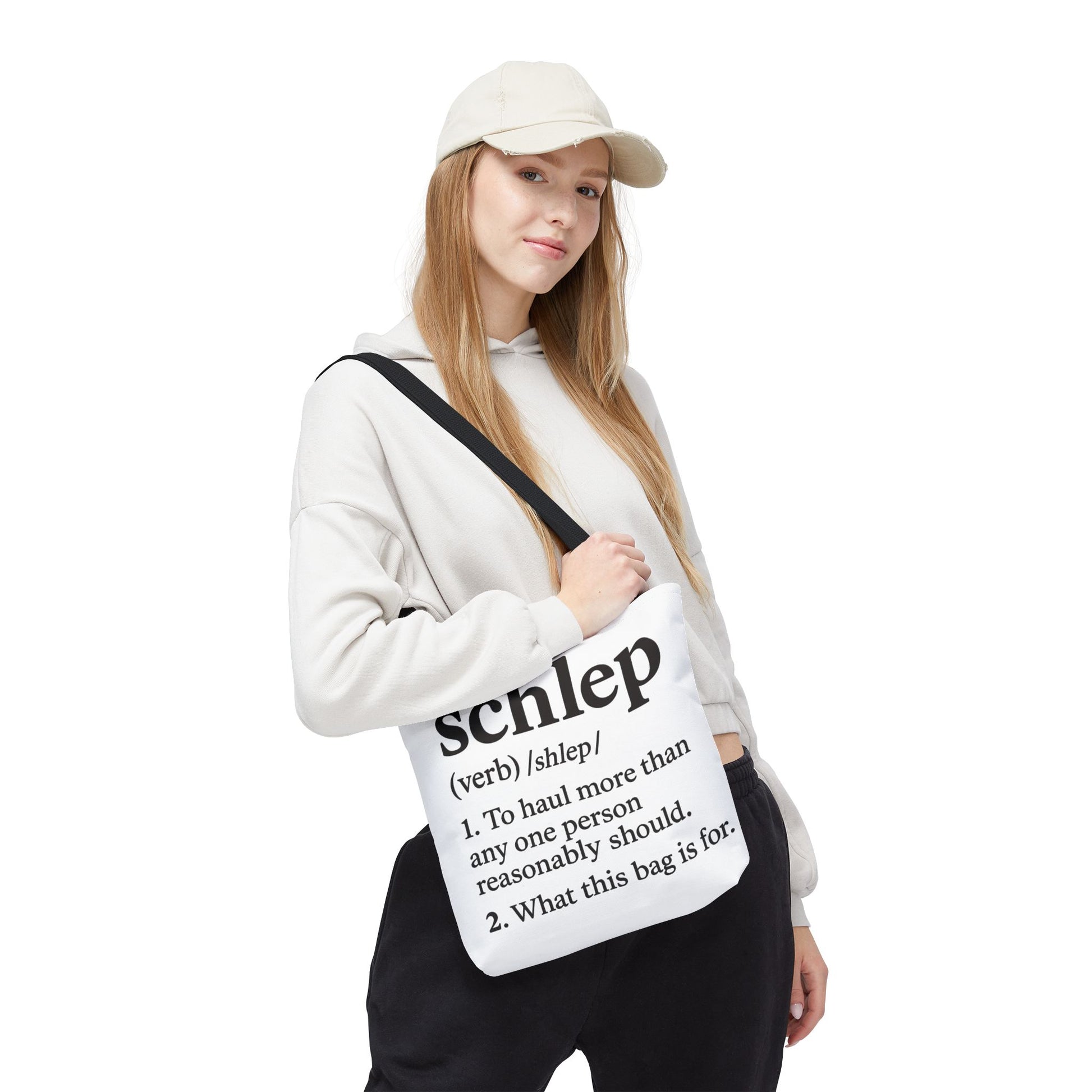 Person holding a bag with text design on a white background