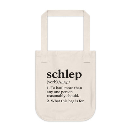 Beige tote bag with black text on a white background