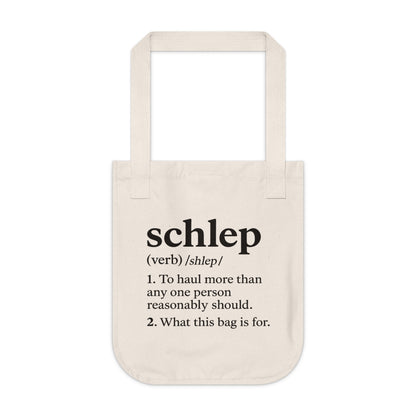 Beige tote bag with black text on a white background
