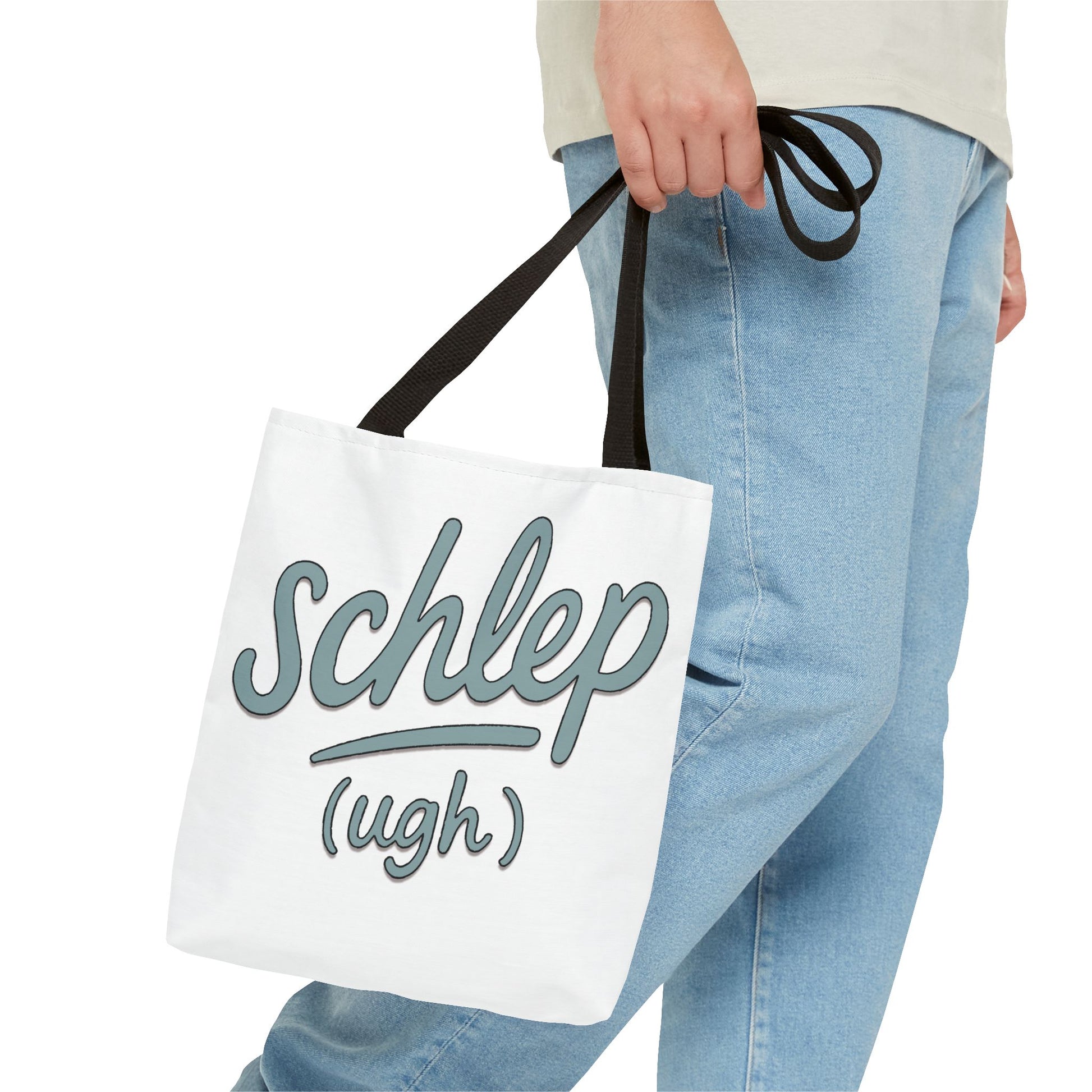 Person holding a white tote bag with 'schlep (ugh)' text.