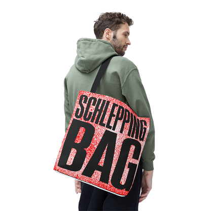 Man wearing a green hoodie with a red and black 'SCHLEPPING BAG' bag over his shoulder on a white background