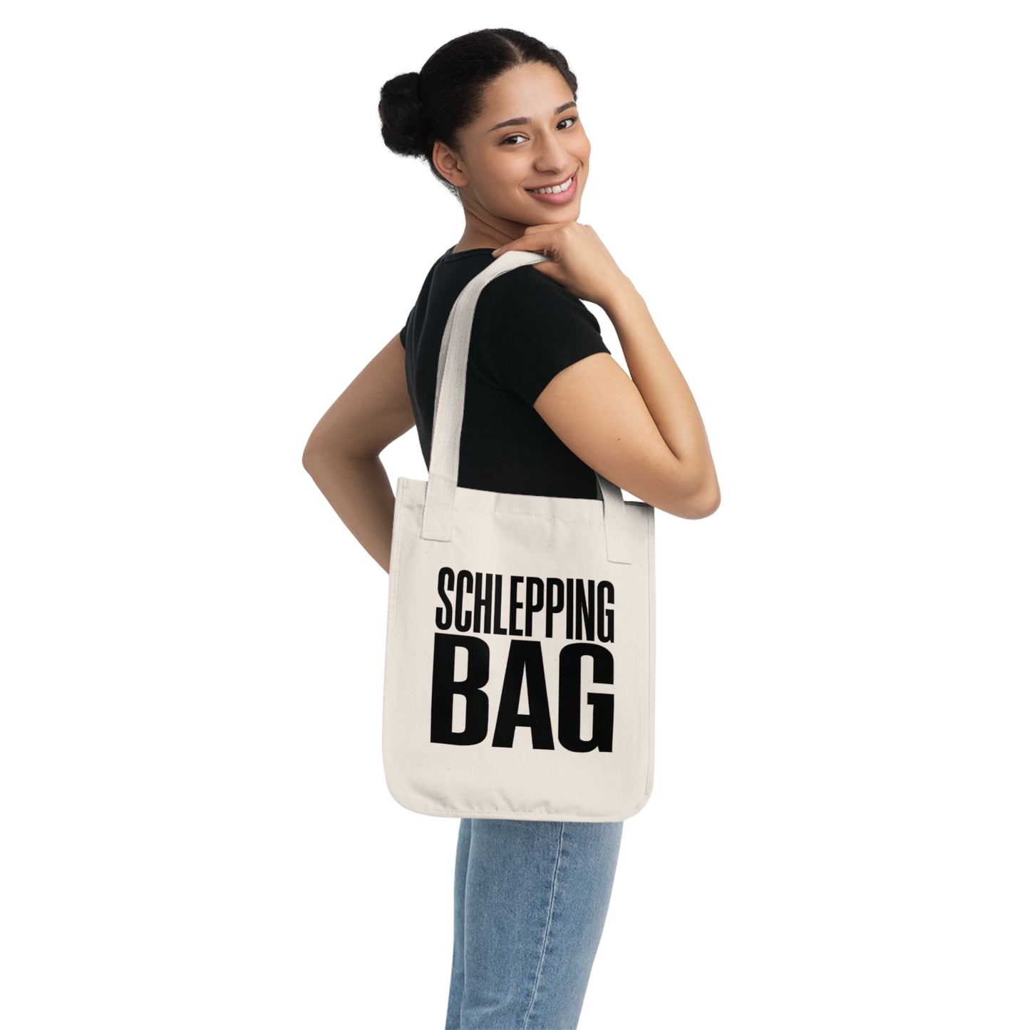 Woman carrying a tote bag with 'SCHLEPPING BAG' text on a white background
