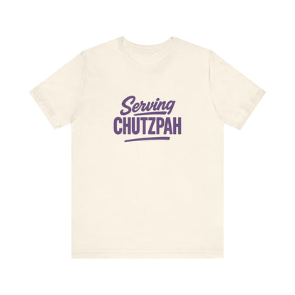 Natural t-shirt with 'Serving Chutzpah' text in purple on a white background