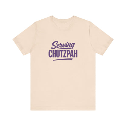 cream t-shirt with 'Serving Chutzpah' text in purple on a white background