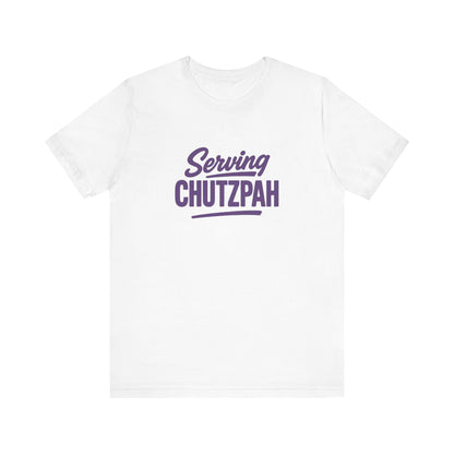 White t-shirt with purple text 'Serving Chutzpah' on a white background