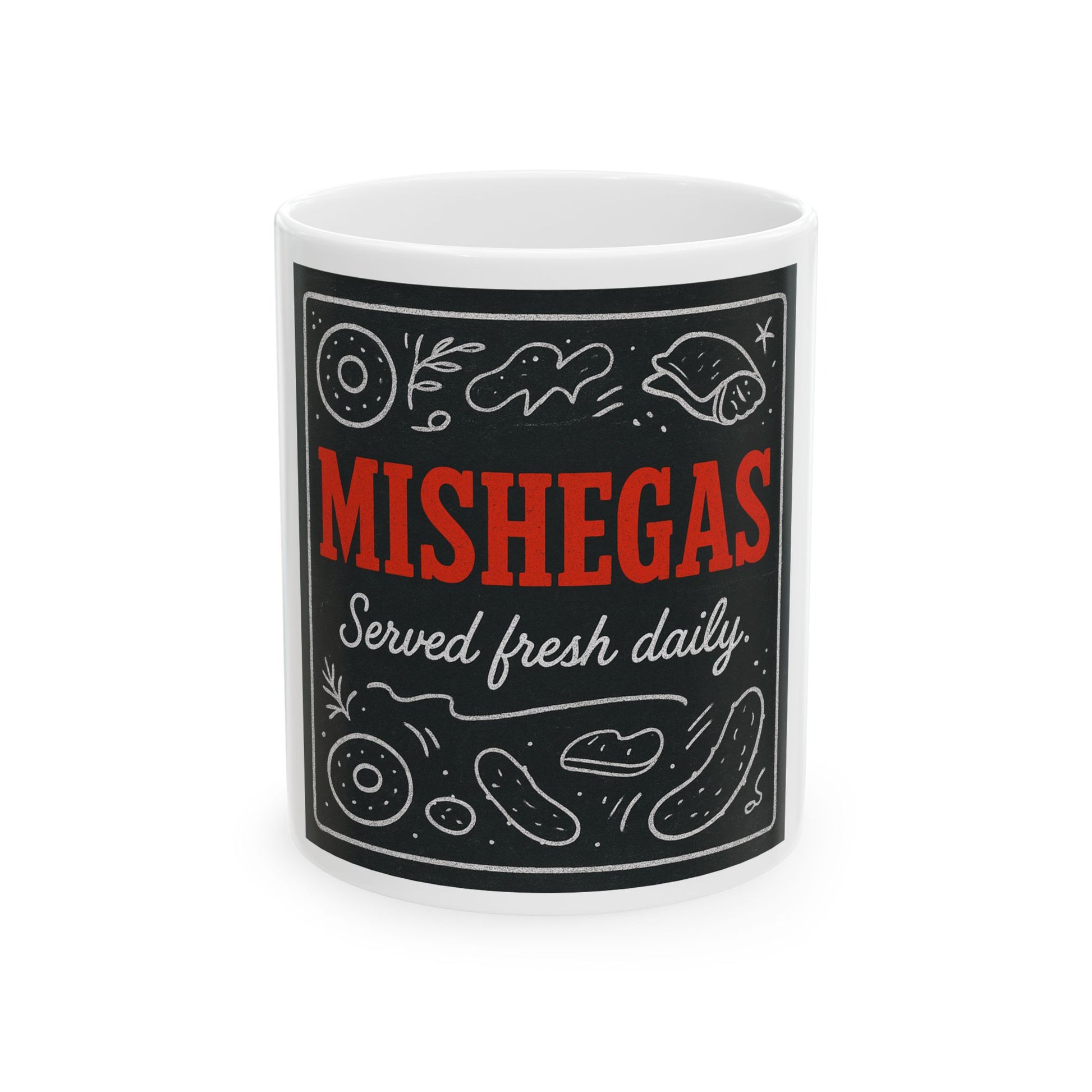 White mug with black label featuring the text 'Mishegas Served fresh daily' on a white background