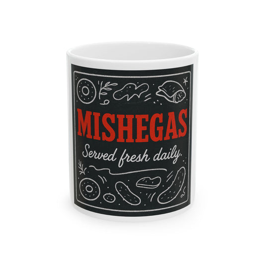 White mug with black label featuring the text 'Mishegas Served fresh daily' on a white background