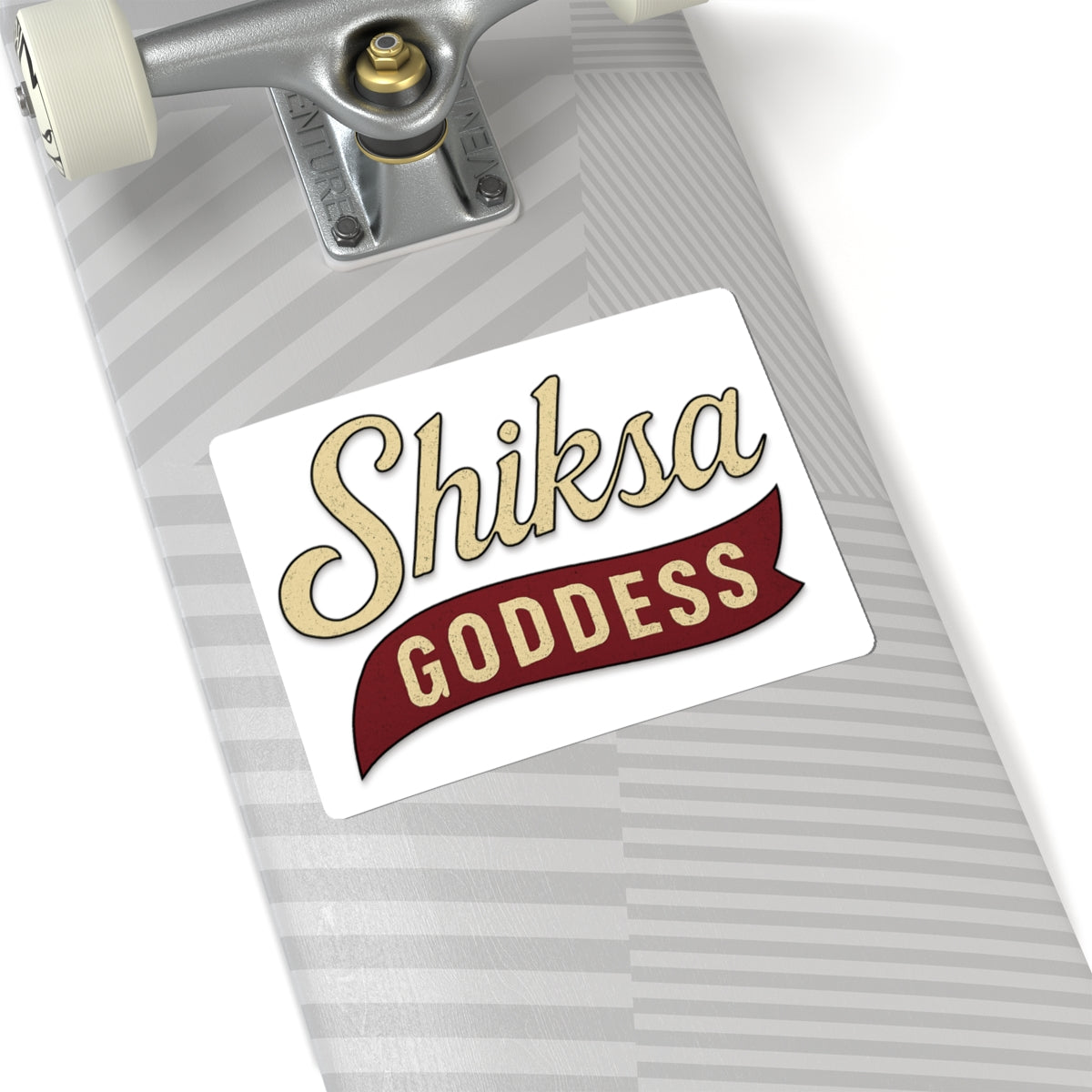 Sticker with 'Shiksa Goddess' text on a skateboard deck