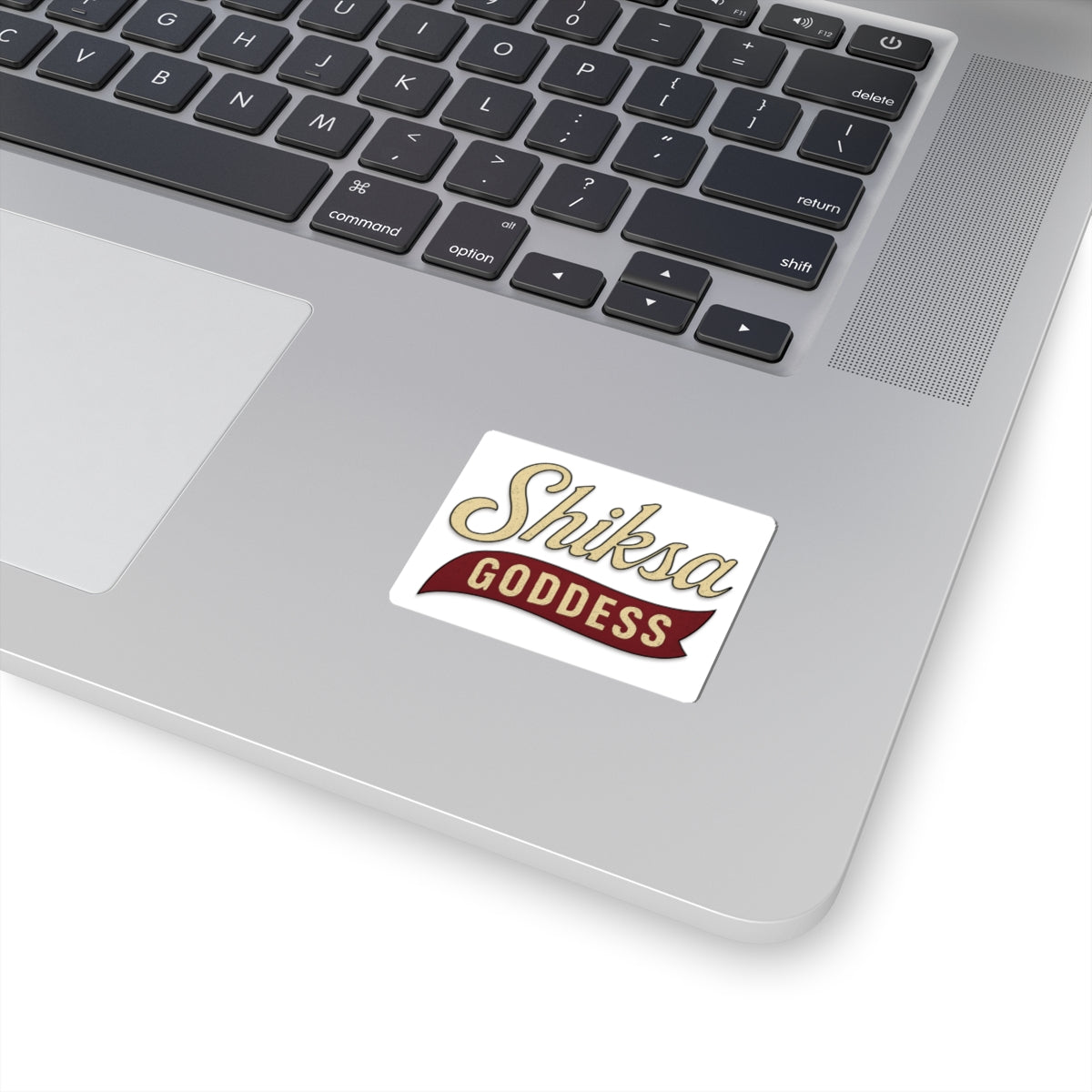 Laptop with a 'Shiksa Goddess' sticker on the palm rest area