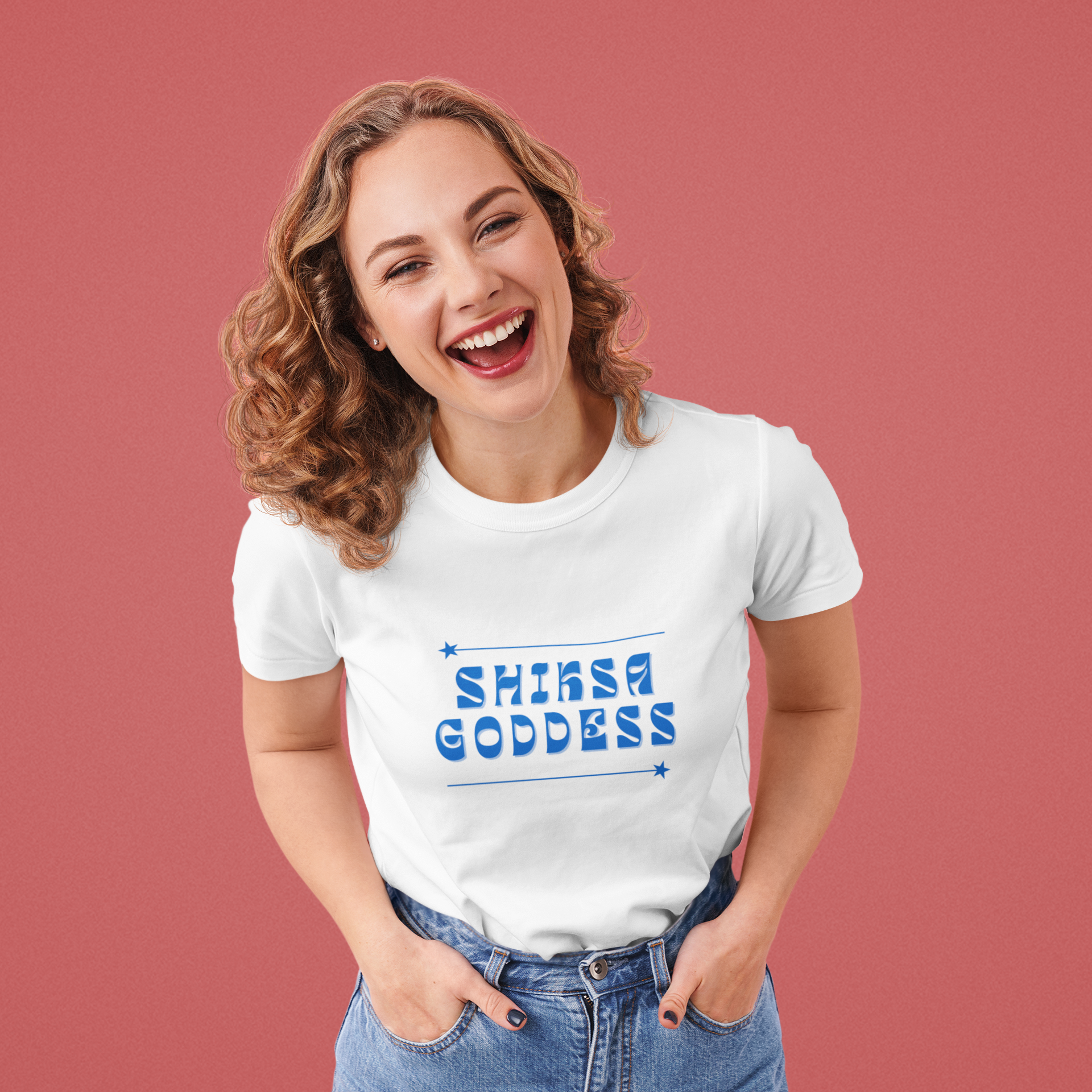 Woman wearing a white t-shirt with 'SHIKSA GODDESS' text on a red background