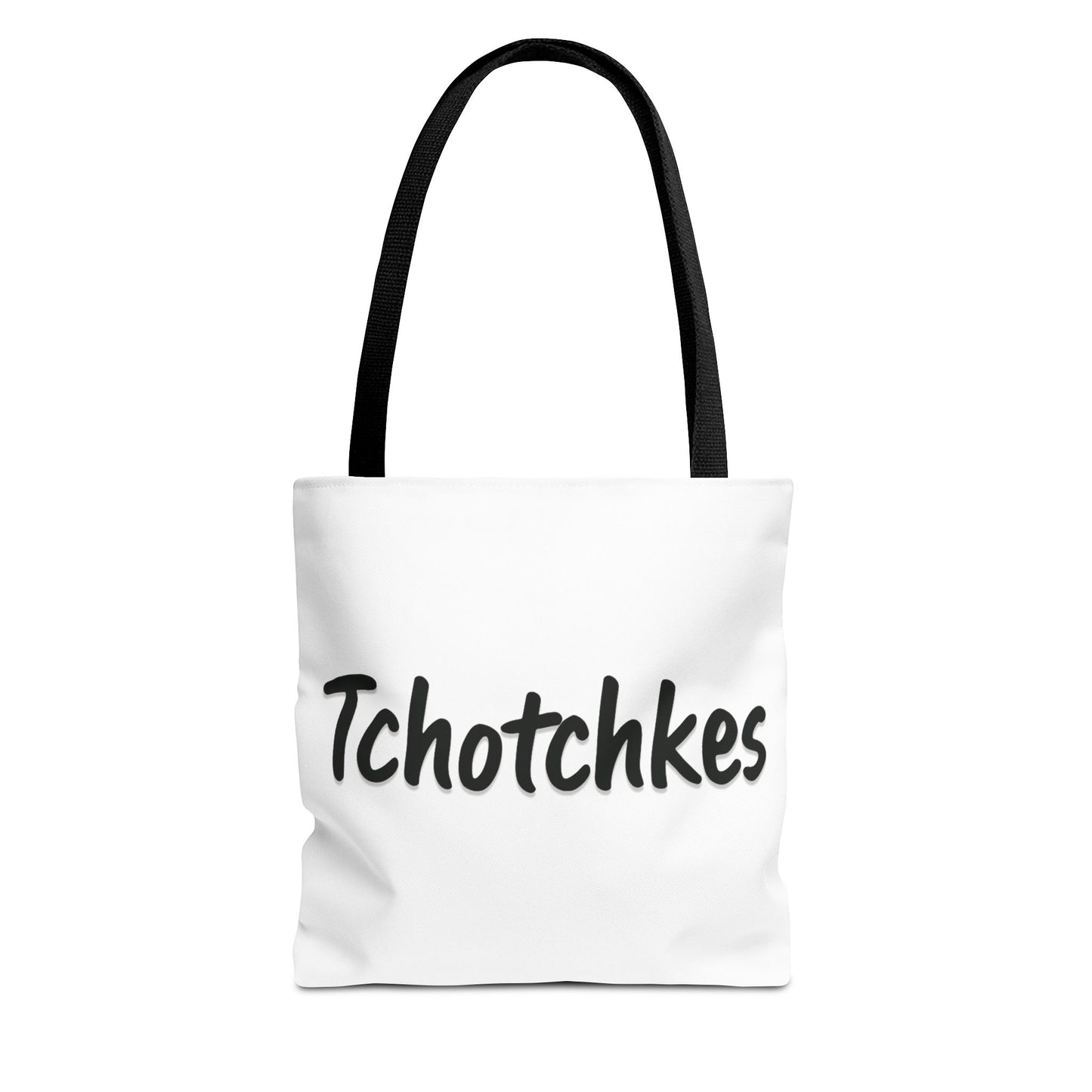 White tote bag with 'Tchotchkes' text and black handle on a white background