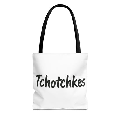 White tote bag with 'Tchotchkes' text and black handle on a white background