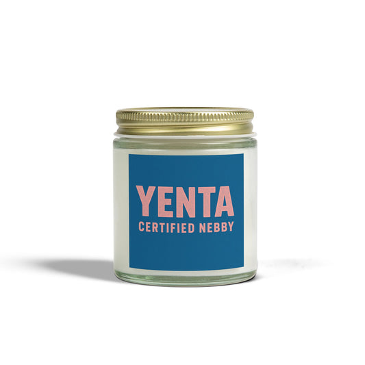 Candle jar with 'Yenta Certified Nebby' label on a white background