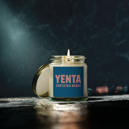 Candle in a jar labeled 'Yenta Certified Neebly' with a dark background