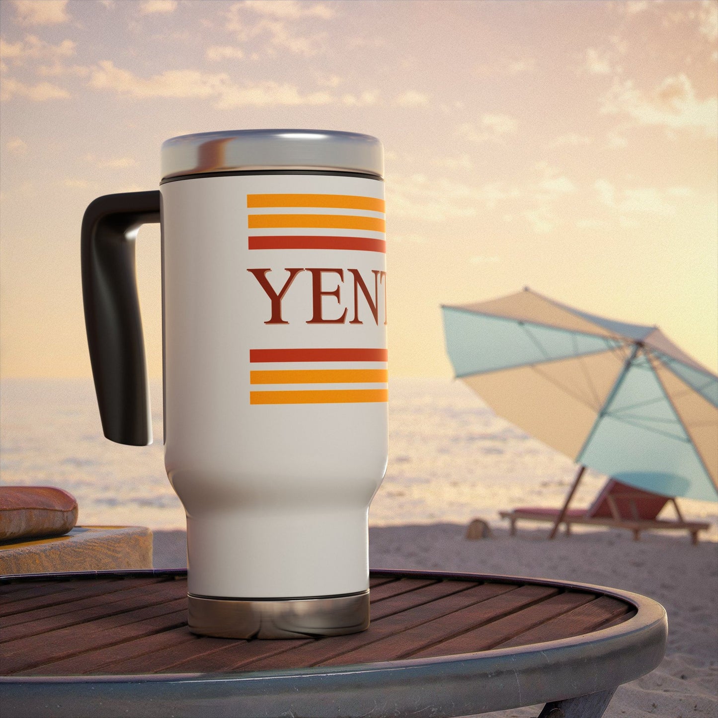 Travel mug with 'YENTA' branding on a beach setting
