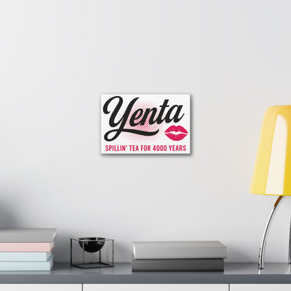Decorative sign with 'Yenta' and 'Spillin' Tea for 4000 Years' text on a wall above a desk.