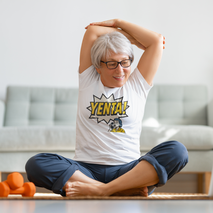Person stretching in a living room wearing a white t-shirt with 'YENTA!' design.