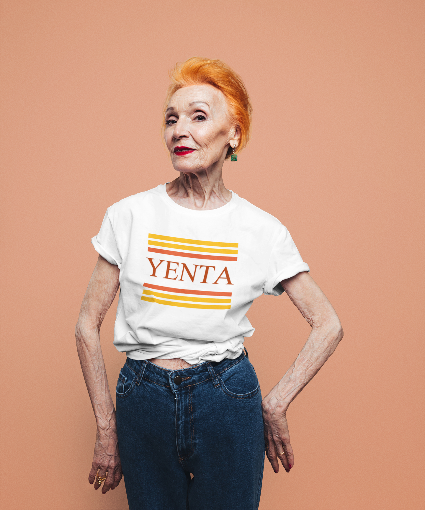 Woman wearing a white t-shirt with 'YENTA' printed on it against a brown background